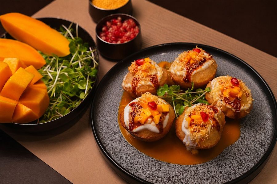 Bharwan dahi puchka: golden puchkas filled with yoghurt, chutneys, sev, mango and pomegranate